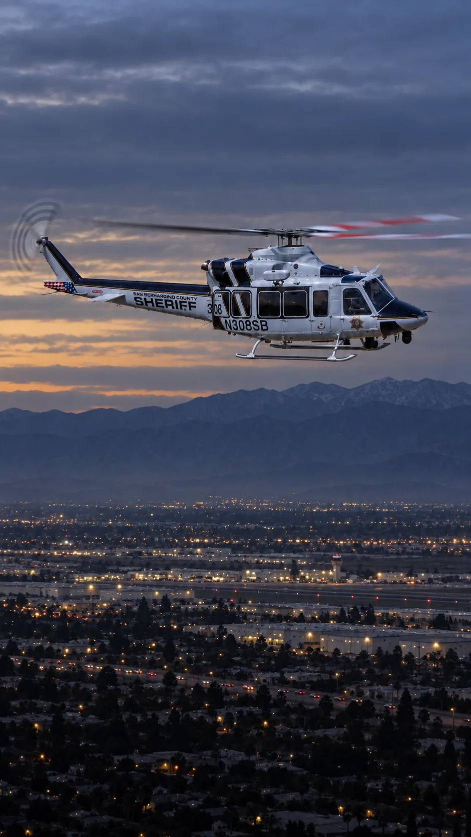Illustration of N308SB, a Bell 412EP of the San Bernardino County Sheriff — over San Bernardino and Highland at the foot of the San Bernardino Mountains.