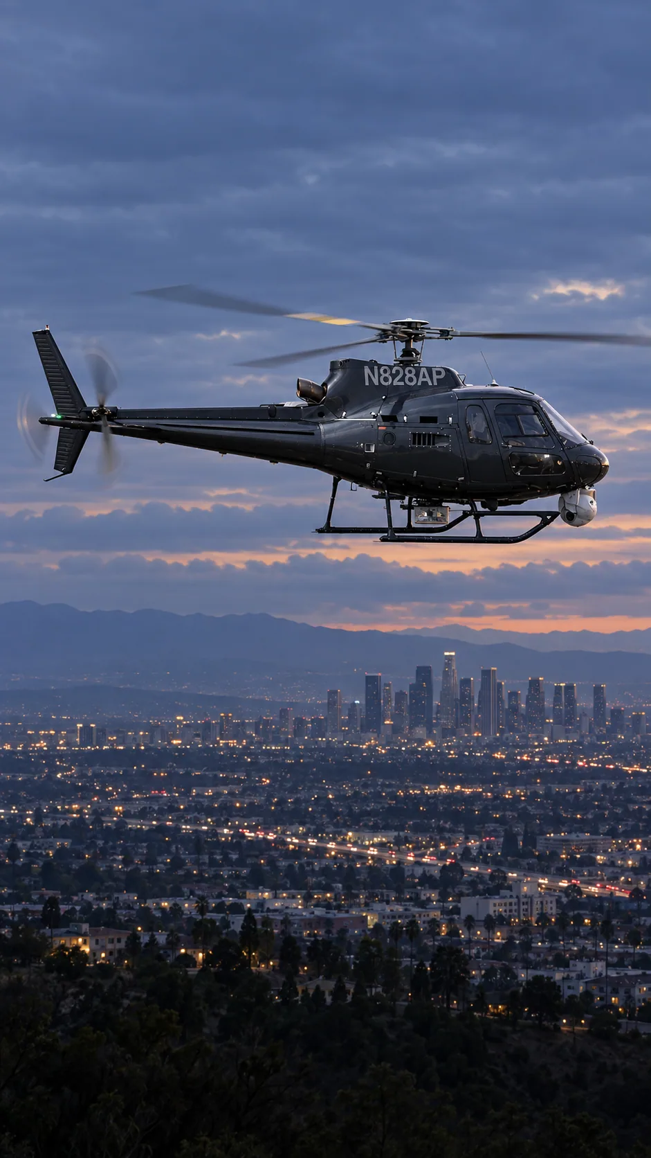 Illustration of ABC NewsCopter (N828AP), an Airbus AS350 B2, over the Los Angeles basin at dusk.
