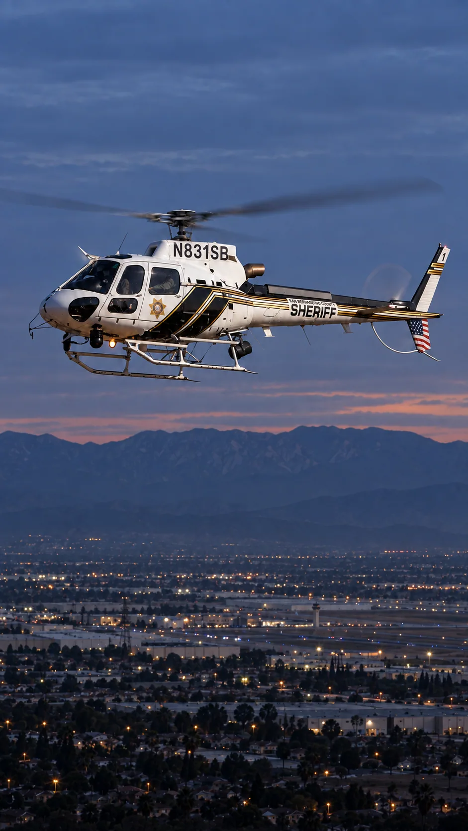 Illustration of N831SB, an Airbus AS350 of the San Bernardino County Sheriff — over San Bernardino and Highland at the foot of the San Bernardino Mountains.