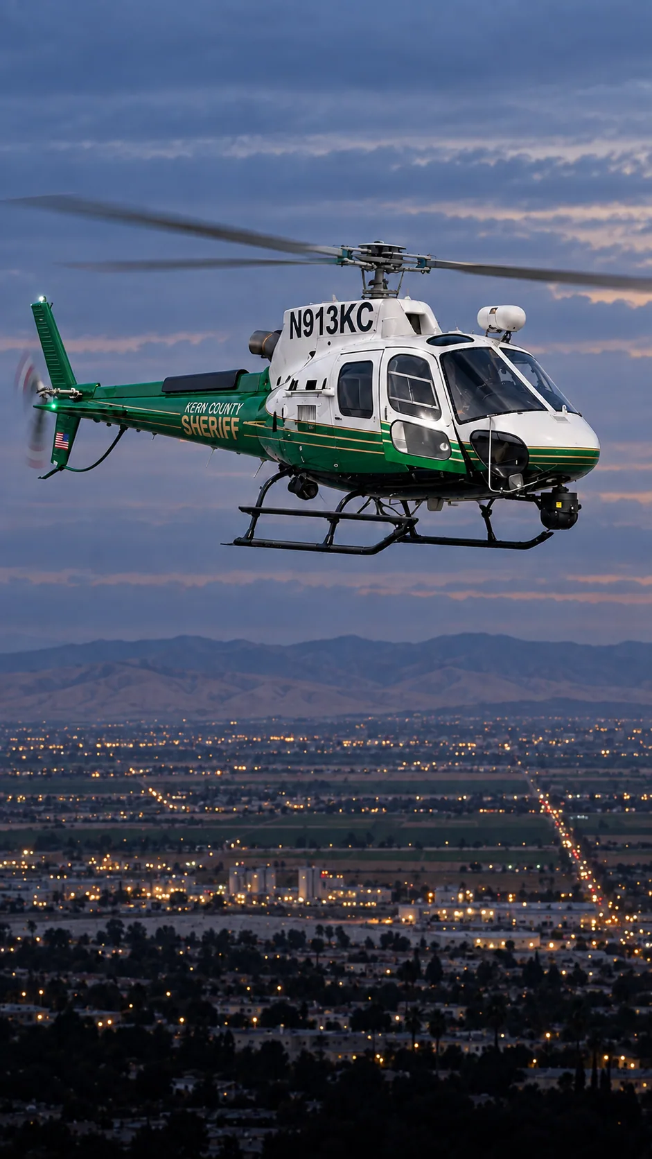 Illustration of N913KC, an Airbus AS350 of the Kern County Sheriff — over Bakersfield, Kern County, seen from the Meadows Field side of town.