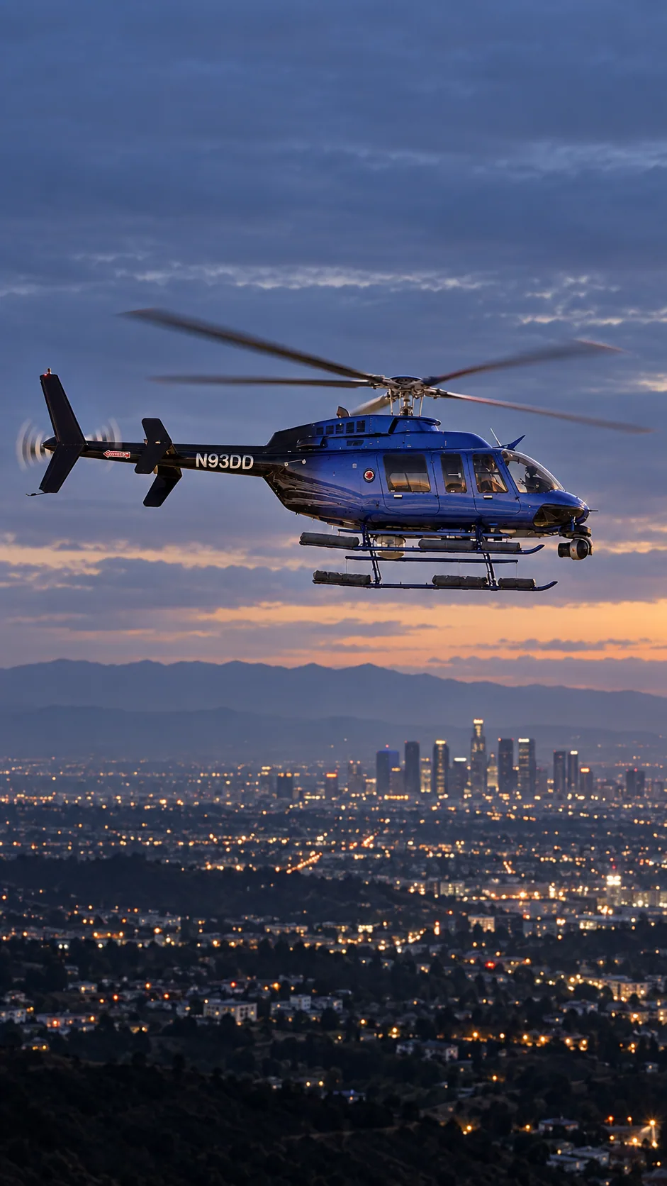 Illustration of SkyFOX 11 / SkyCAL (N93DD), a Bell 407, over the Los Angeles basin at dusk.